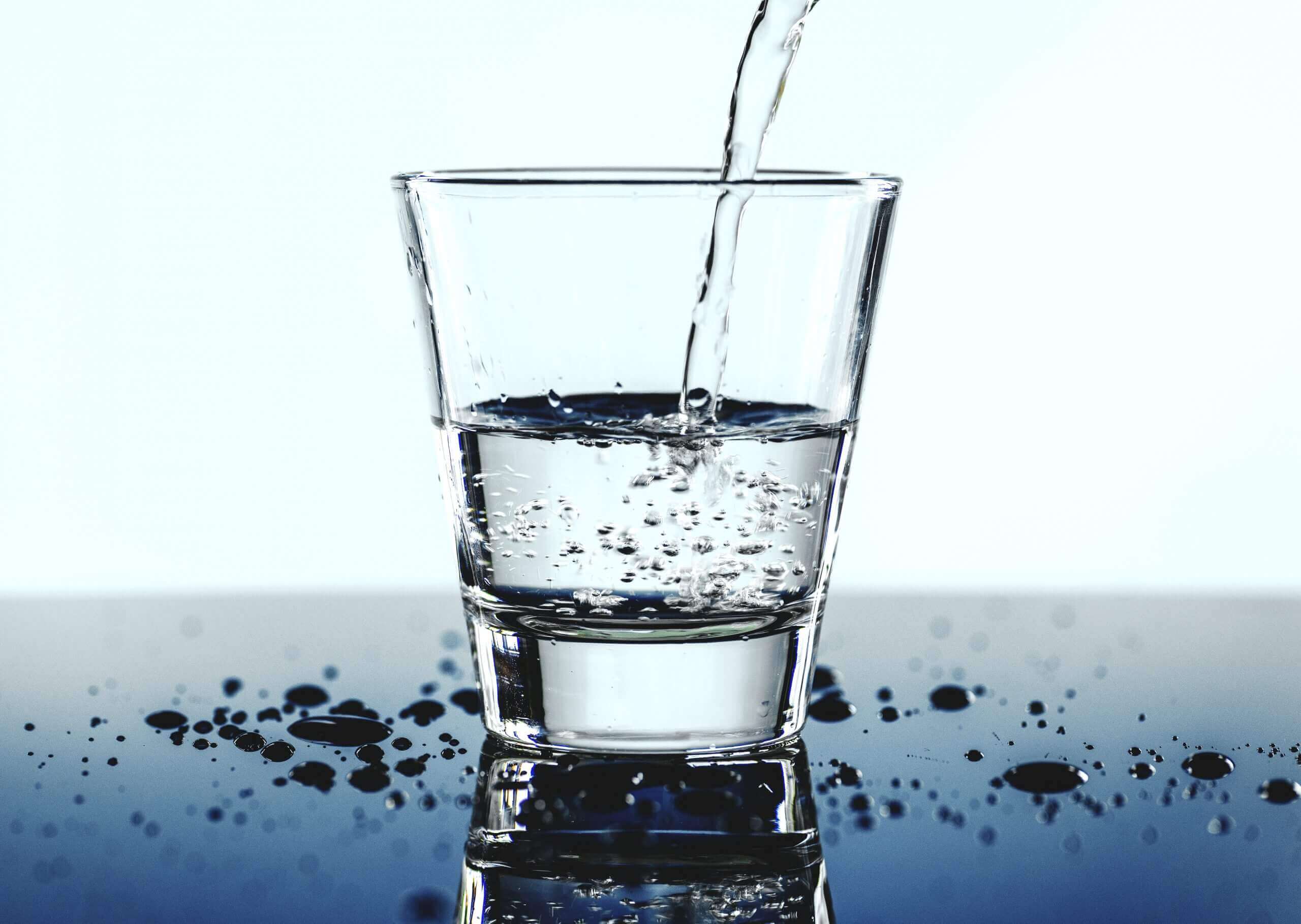 glass of water macro shot scaled
